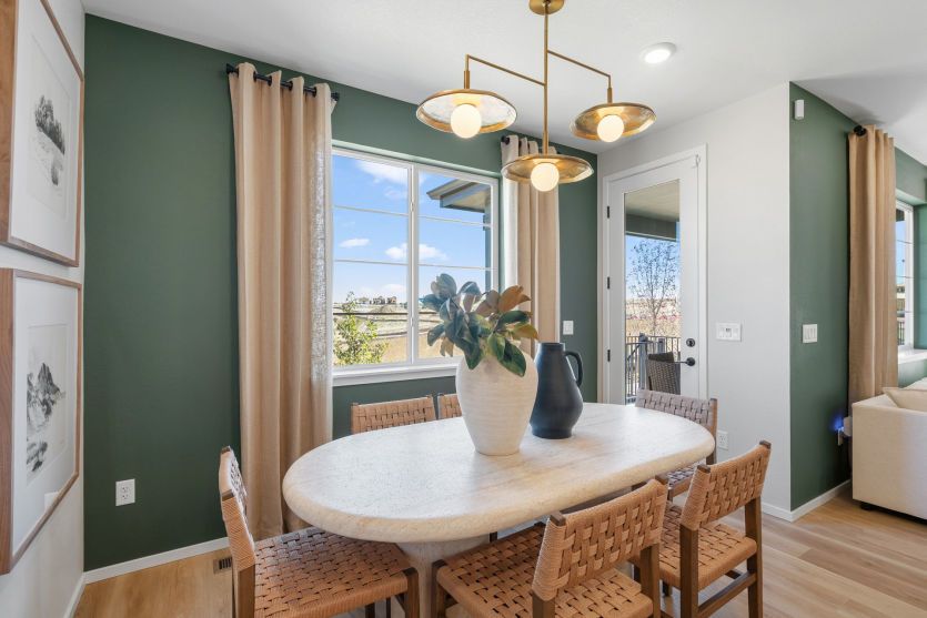 Dining Area with Door Leading to Covered Patio