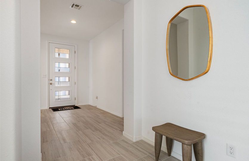 Secondary bedrooms and the den are located off of the foyer