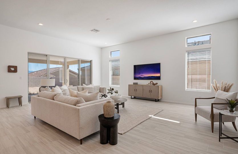 Large windows and center sliding door intentionally brighten up the space