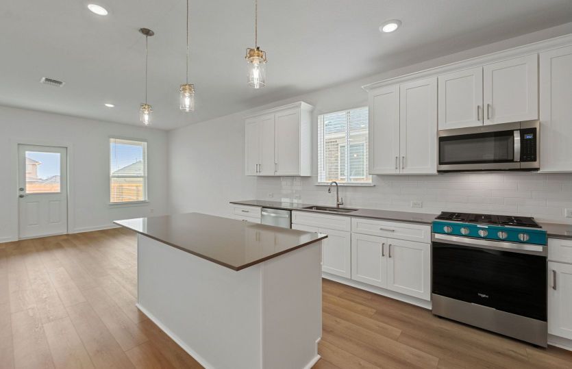 Representational Photo- Kitchen Open to the Dining Area