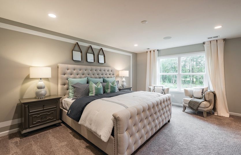 An elegant Owner's Suite with space to relax