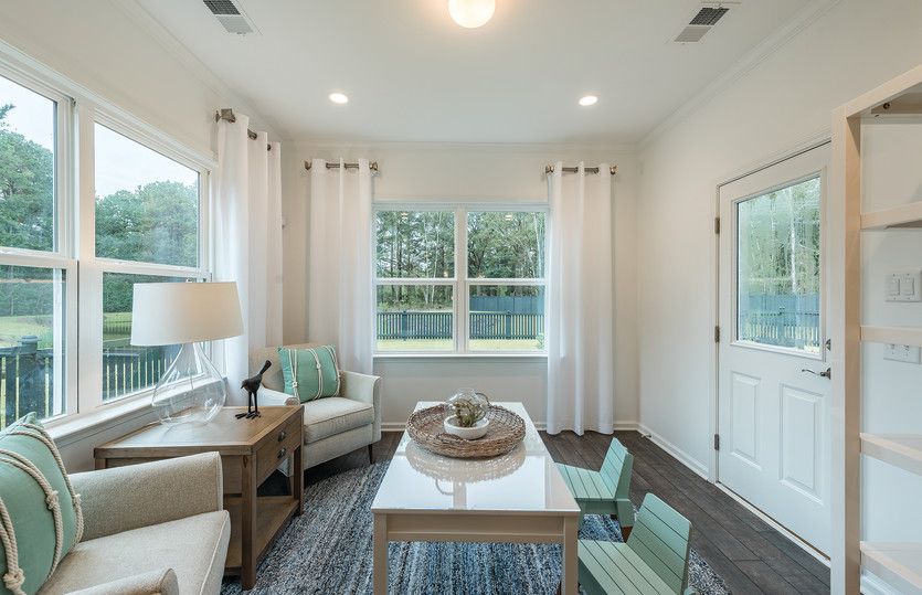 Retreat to a bright and relaxing sunroom with plenty of windows