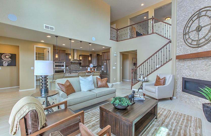 Lovely gathering room interior showing the cathedral ceiling, designer stair railing and a beautiful