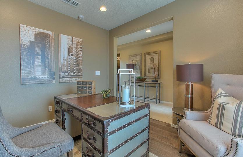 Den just off the foyer designed for a home office or flexible living space. Add French doors to crea