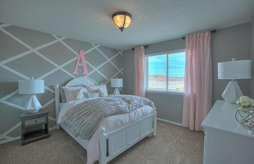 Fourth bedroom on the second floor with a bright and open window as well as carpet flooring and a la