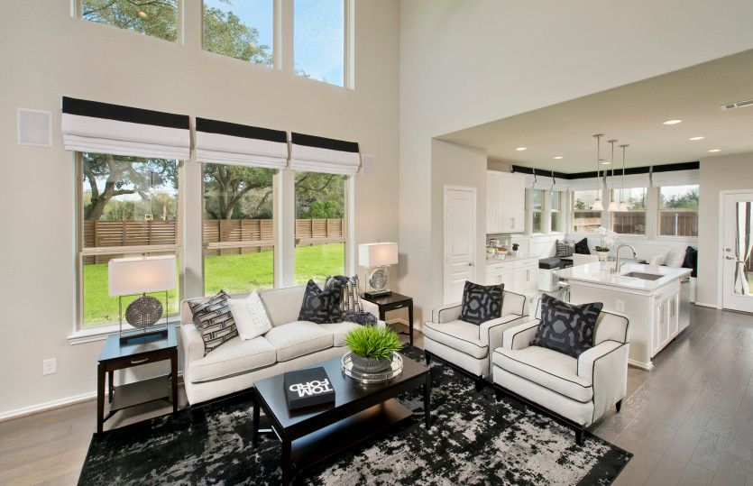 Gathering room with two-story ceilings and large windows