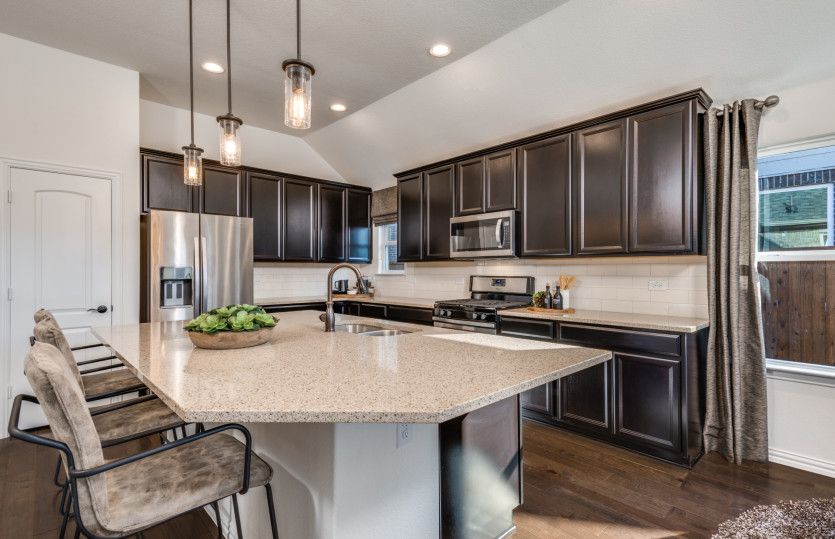 Abundant counter and cabinet space in this kitchen, perfect for meal prep or entertaining