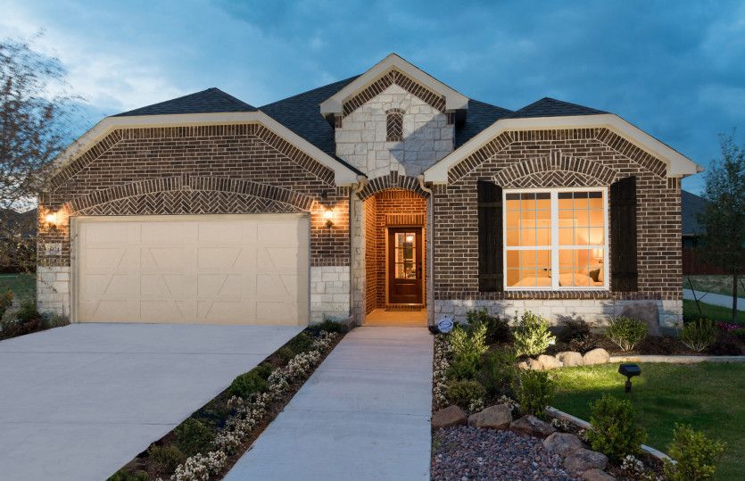 Exterior C with stone accents, black shutters, and 2-car garage with storage space