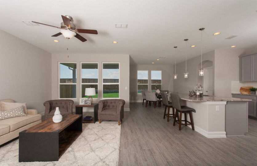 The gathering room features abundant natural light and optional fireplace