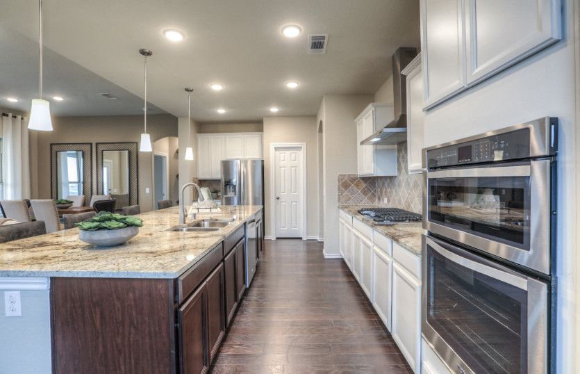 Island kitchen with pendant and recessed lighting