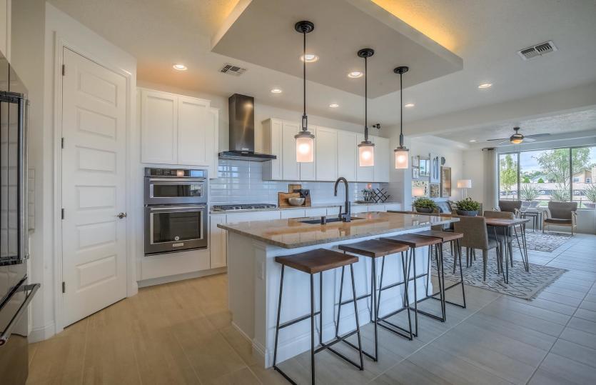Impressive kitchen modeled with accent ceiling, built-in appliances and a large corner pantry plus k