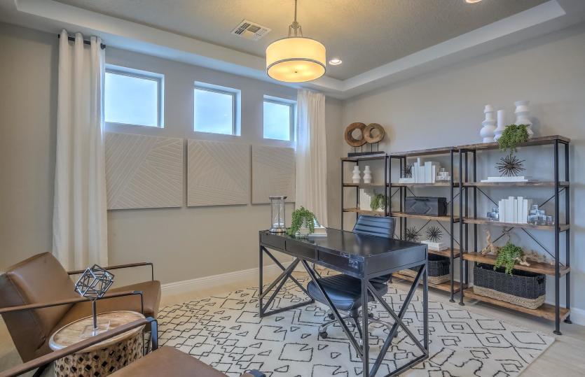 The den just off the kitchen allows for a home office and can be enhanced with tray ceiling and deco