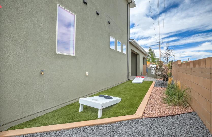 Get inspired to dress up your yard with planters, greenery and even outdoor games.
