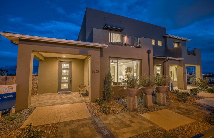 Saguaro model home showing landscaped front yard and balcony from the owner's suite.