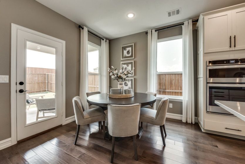 Spacious dining area off kitchen with access to covered patio