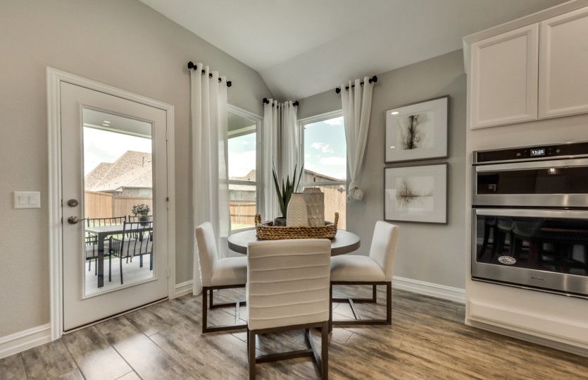 Breakfast nook off kitchen with access to covered patio