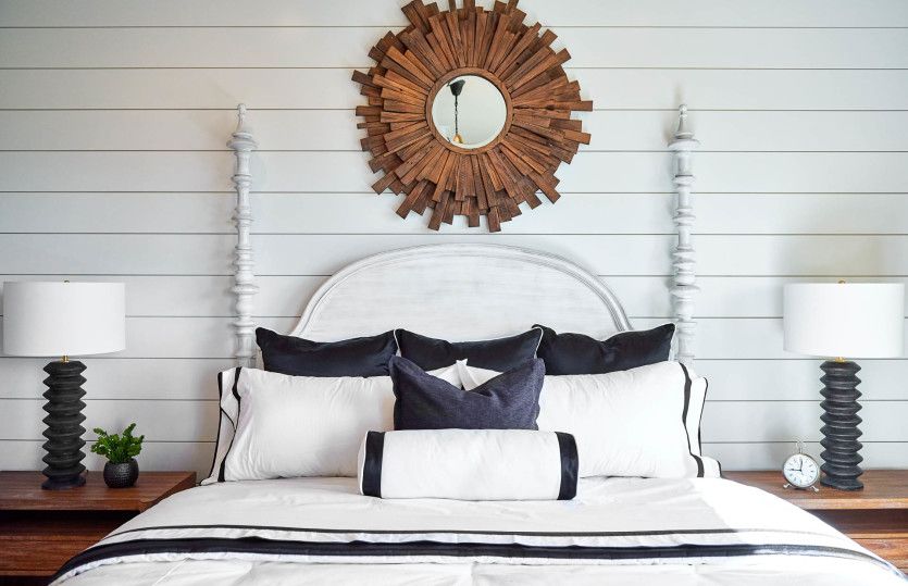 Owner's suite decorated with white trim painted wall and trendy furnishings.