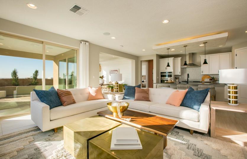 The gathering room opens to the kitchen and cafe, as well as the covered patio and backyard for indo