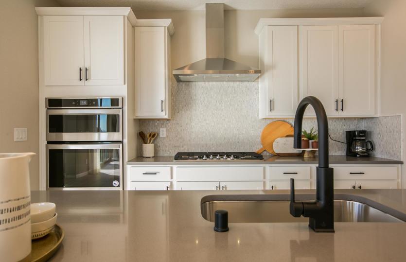 Use the kitchen island as a casual spot for busy morning breakfasts or to host your cocktail party a