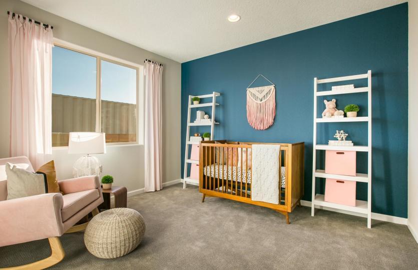Bedroom 3 decorated as a nursery room includes a blue accented wall, cozy carpet, and a spacious clo