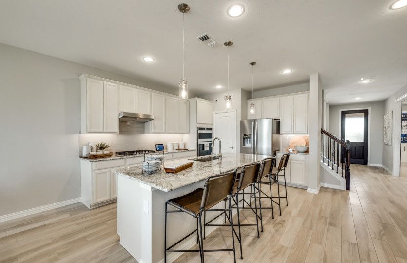 Spacious island kitchen with eat-in bartop*model representation