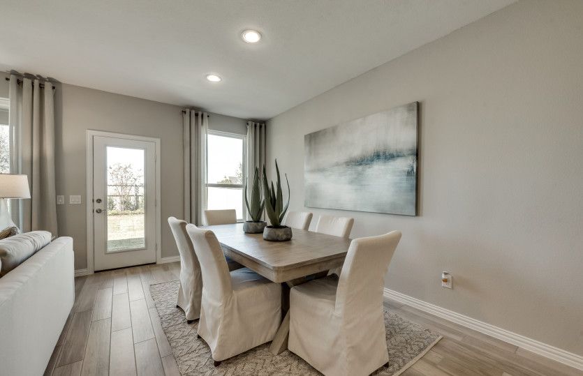 Dining area off kitchen with large window*model representation
