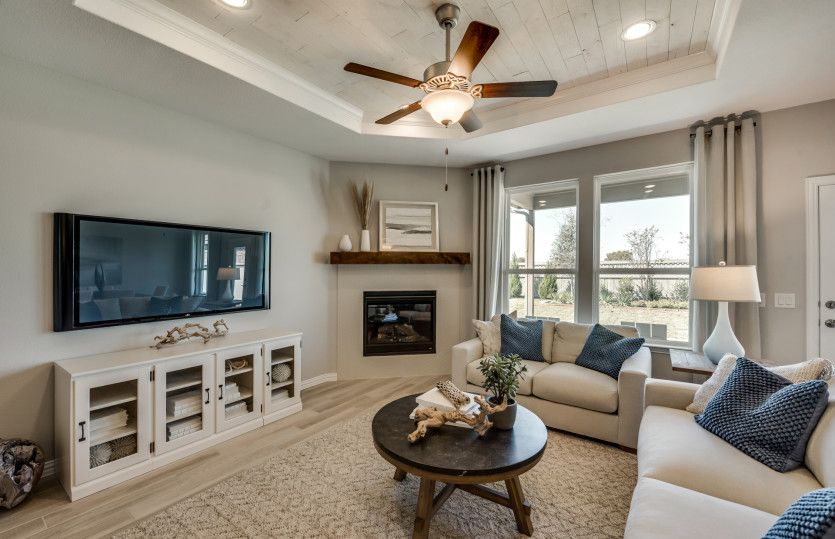 Gathering room with optional fireplace and large windows*model representation