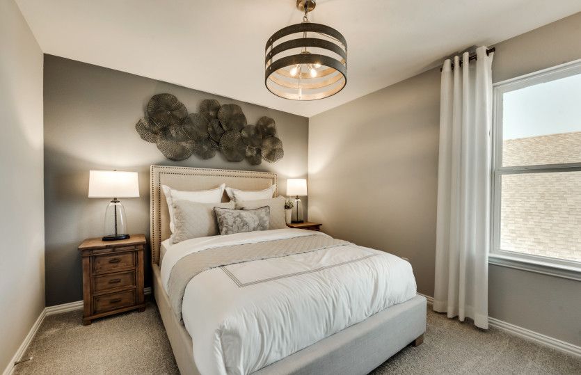 Spacious secondary bedroom*model representation