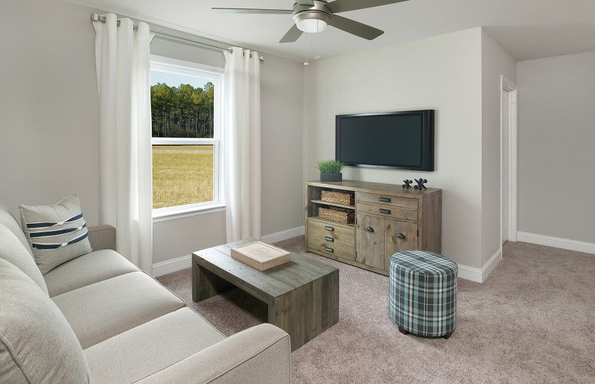 A cozy upstairs loft area is the perfect place to play games or watch a movie