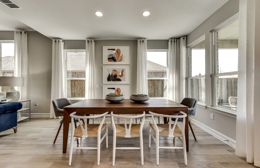 Spacious dining area with recessed lighting