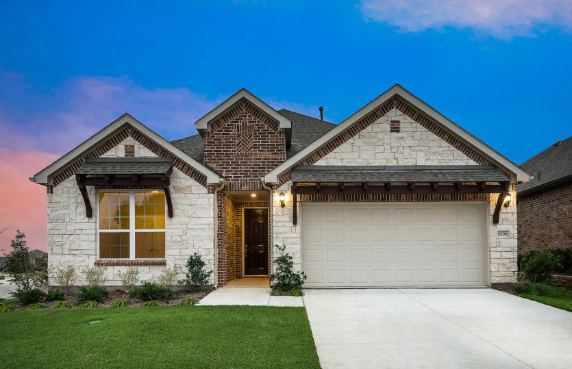 Exterior D with stone and a 2-car garage with storage space