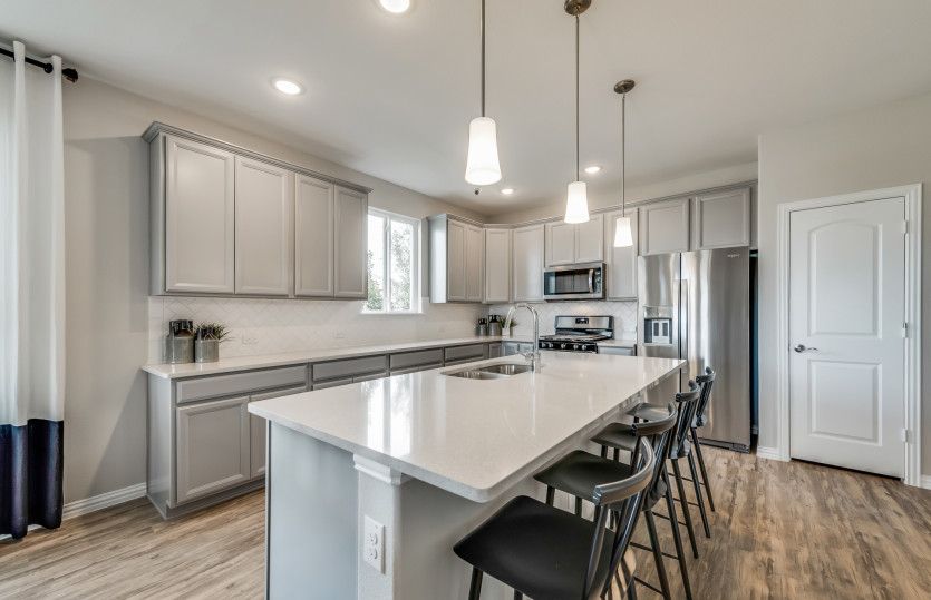 Spacious island kitchen with eat-in bartop*model representation