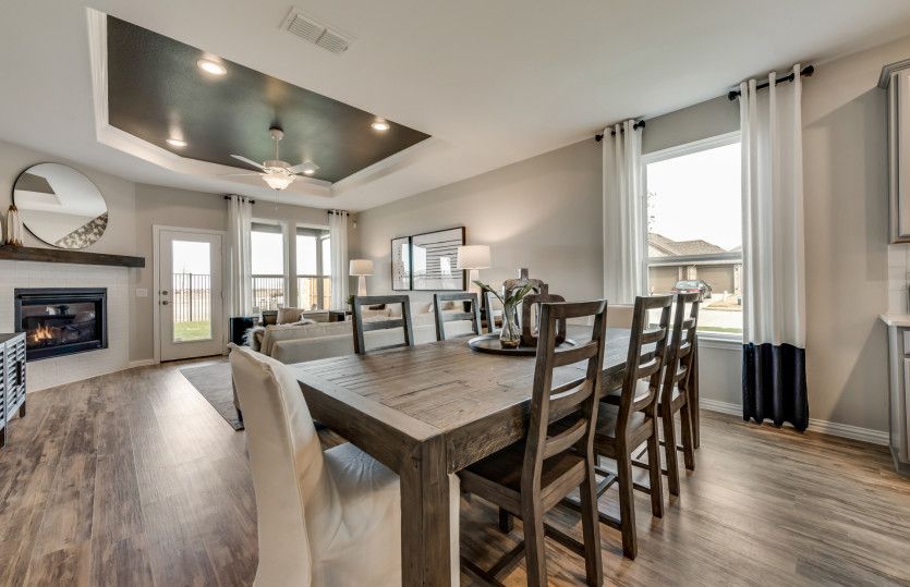 Dining area off kitchen with large window*model representation