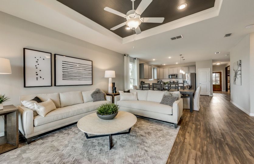 Gathering room with view of dining and kitchen areas*model representation