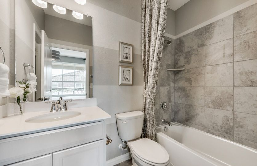 Spacious secondary bathroom*model representation