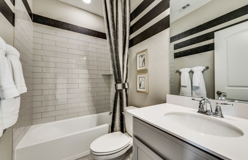 Spacious secondary bathroom*model representation