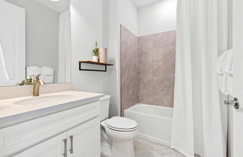 Secondary bathroom with tub and shower combination