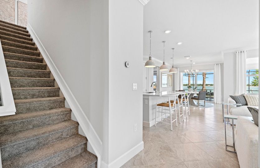 Stairs to the loft featuring a bed and bath
