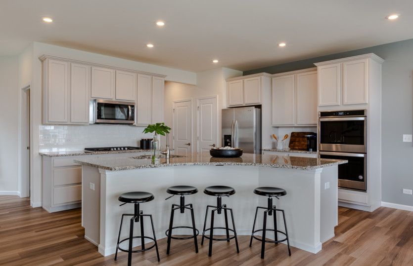 Kitchen with Featuring a Curved Island