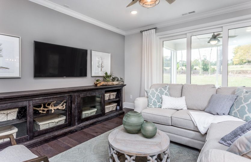Beautiful gathering room with slider and screen lanai