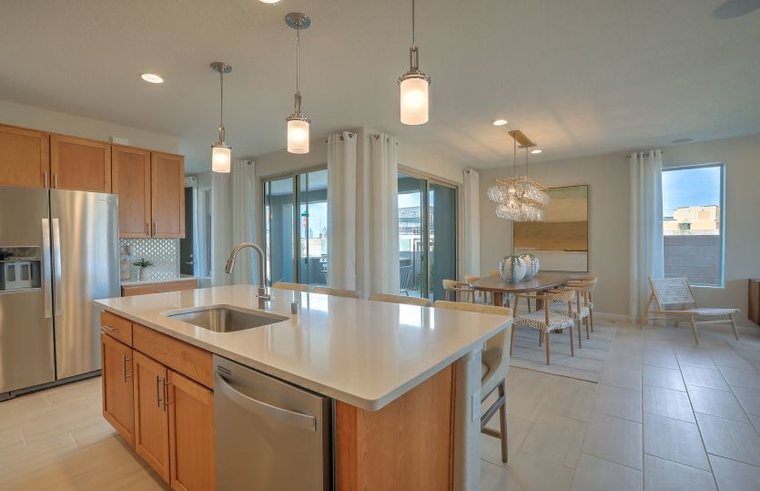 The island provides a space for casual breakfasts or acts as a location for hosting party platters a