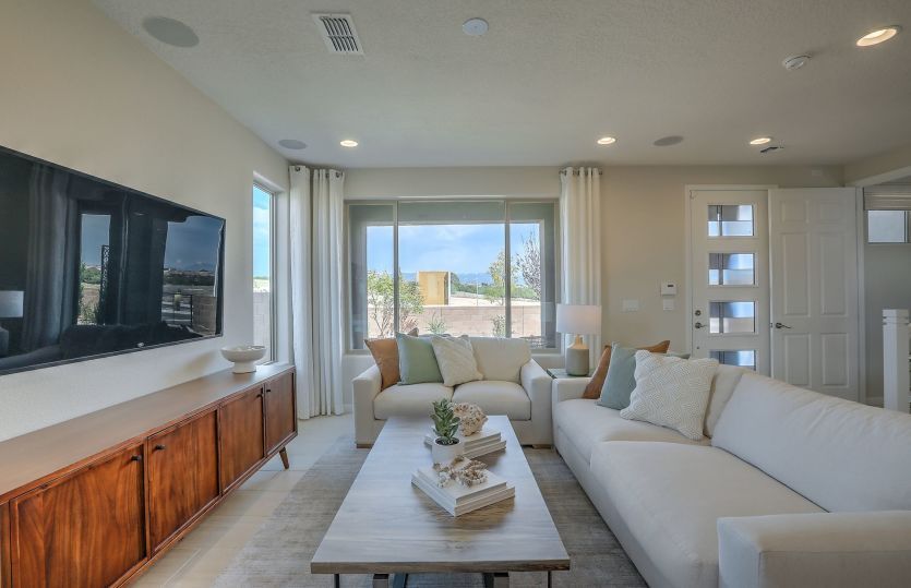 Lots of windows brighten up the gathering room of the Senita home design offered at Villas de Las So