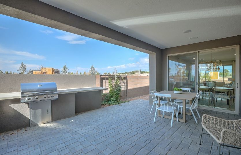 Covered patio is accessible through a gate or through the sliding glass door from the cafe or kitche