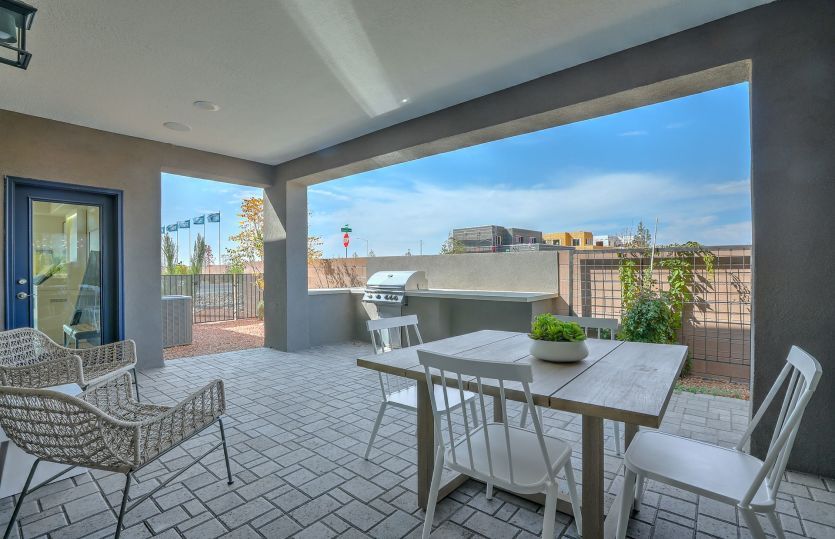 Large covered patio demonstrates plenty of space for a built-in BBQ grill, and seating for a loungin