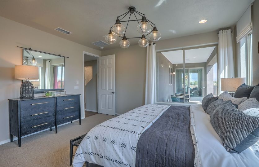 A bright window in the owner's suite can be replaced with a sliding glass door for access to the cov