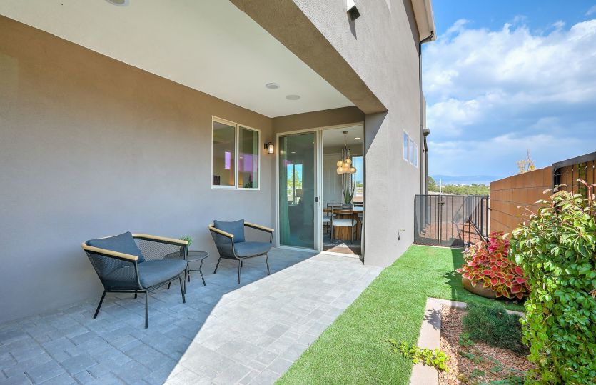 Covered patio and yard are accessed from the interior at the cafe or from the side-yard gate.