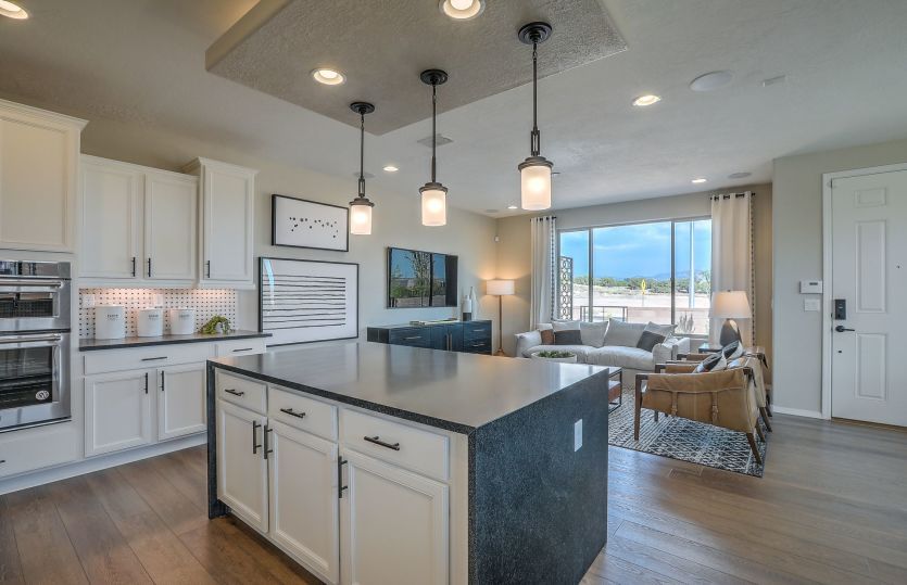 Over the island is the option to add a drop-down accent ceiling and pendant lights for an impressive