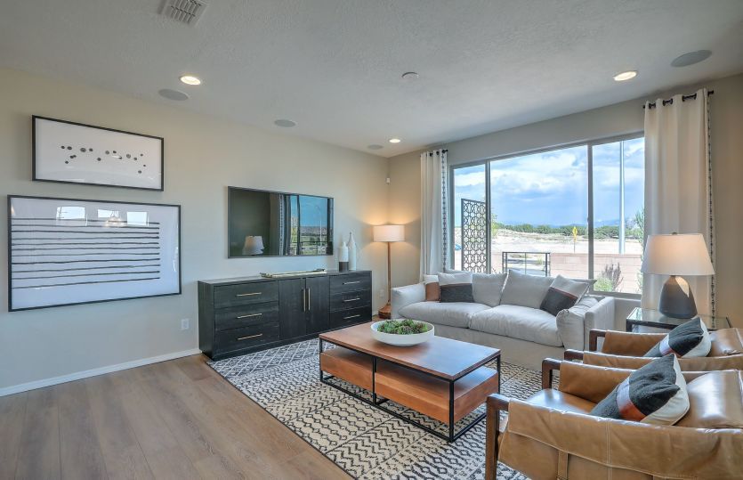 Gathering room offers space for ample seating, a bright window and overhead lighting.