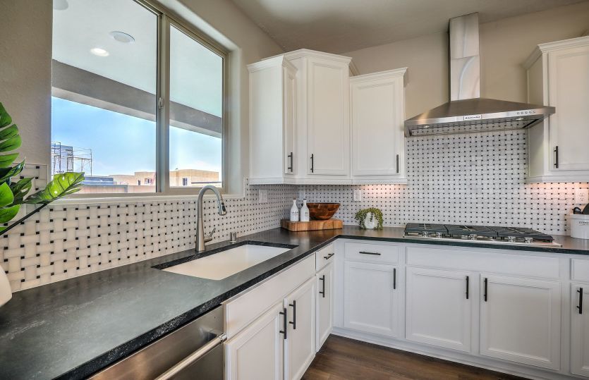 A closeup of the kitchen shows the flexibility to personalize your counertops, backsplash, cabinets