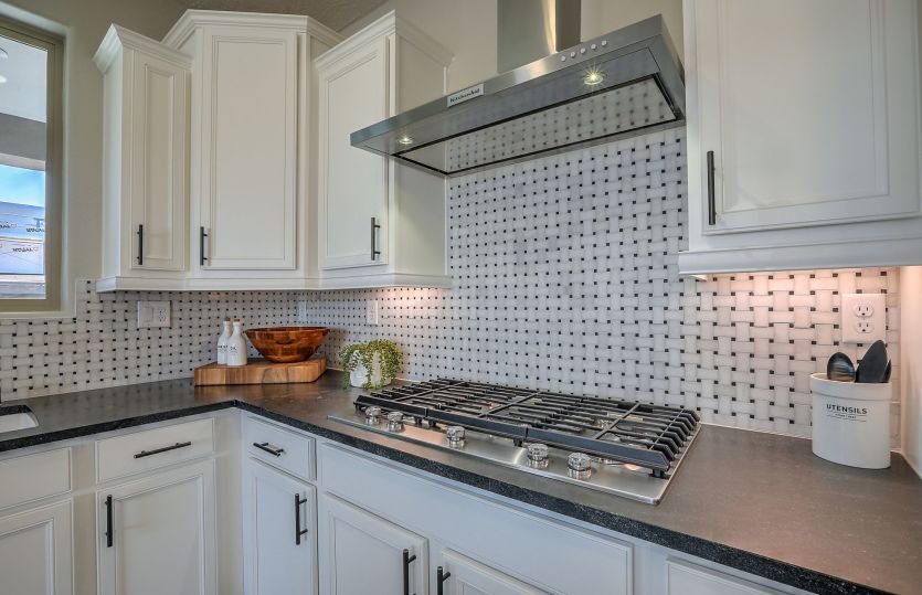 At our professional design center you'll choose your backsplash options like this black and white ti